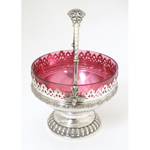 544 - A WMF silver plate sugar bowl with loop handle and cranberry glass liner. Approx. 6 1/2