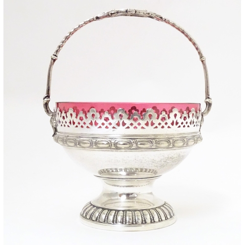 544 - A WMF silver plate sugar bowl with loop handle and cranberry glass liner. Approx. 6 1/2