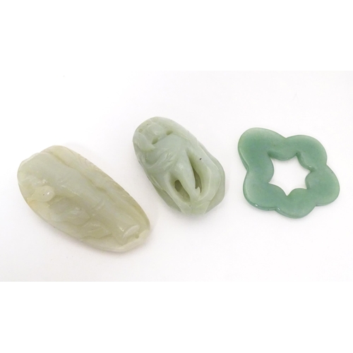 716 - Three various carved jade coloured pendants. the longest 2 1/2