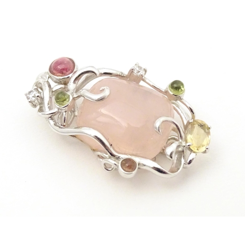 733 - A .925 silver pendant set with central rose quartz and various coloured stone. Approx. 1 3/4