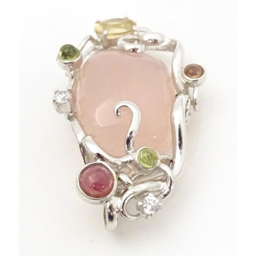 733 - A .925 silver pendant set with central rose quartz and various coloured stone. Approx. 1 3/4