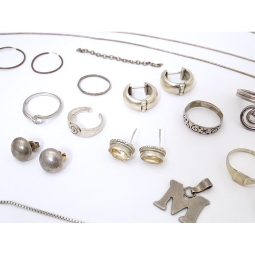 737 - Assorted silver and white metal jewellery to include various rings, earrings, pendants, etc.