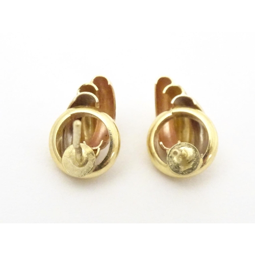 739 - A pair of 18ct gold stud earrings. Approx. 1/2