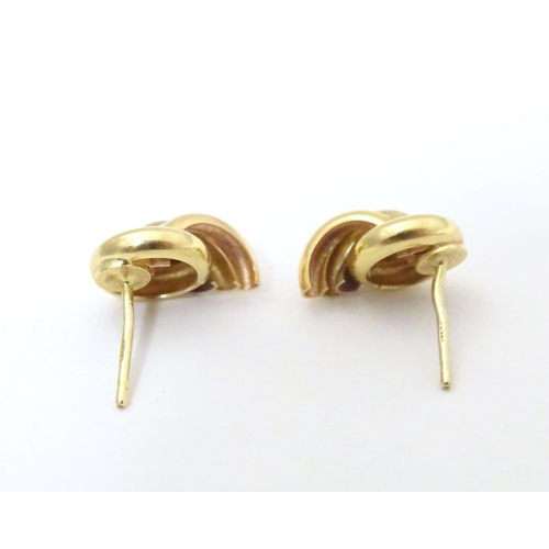 739 - A pair of 18ct gold stud earrings. Approx. 1/2