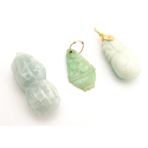 745 - Assorted Oriental carved jade and hardstone pendants. Largest approx. 2