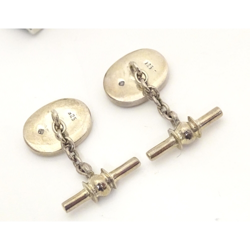 746 - Two pairs of cufflinks to include a silver example. (2+2)