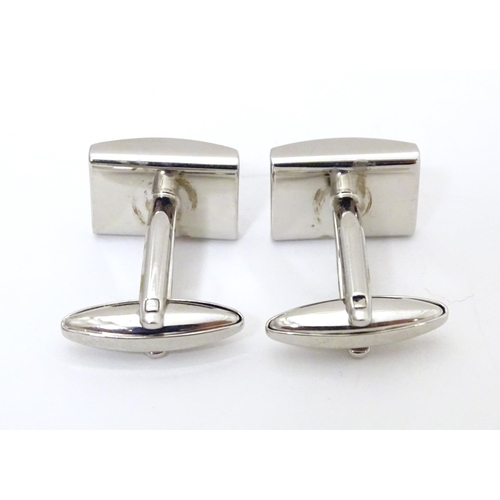 746 - Two pairs of cufflinks to include a silver example. (2+2)