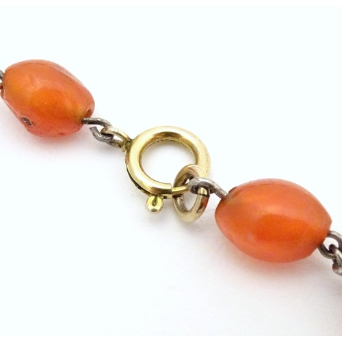 750 - A white metal necklace of graduated carnelian stone beads. Approx. 30