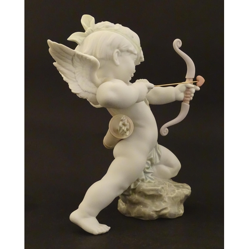 116 - A Lladro figure modelled as Cupid with bow, Straight to The Heart, model no. 9209. Marked under. Wit... 