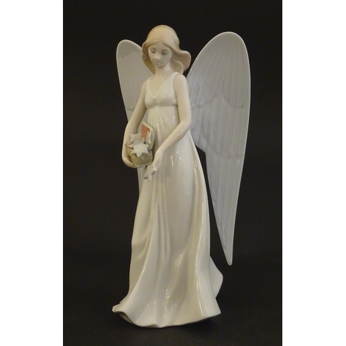 119 - A Lladro figure modelled as an angel with a box of stars, Angelic Star, model no. 8534. Marked under... 