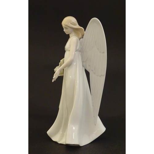 119 - A Lladro figure modelled as an angel with a box of stars, Angelic Star, model no. 8534. Marked under... 