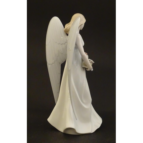 119 - A Lladro figure modelled as an angel with a box of stars, Angelic Star, model no. 8534. Marked under... 