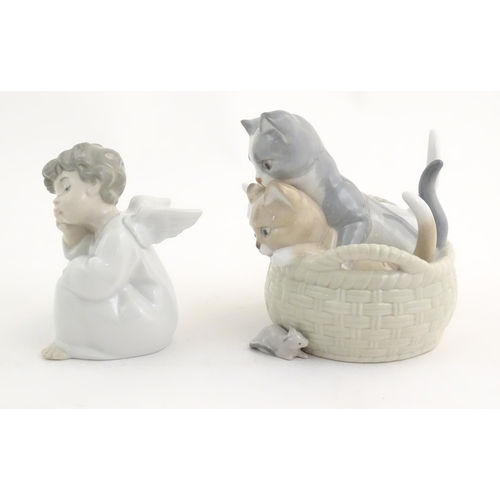 120 - Two Lladro figures comprising Thinking Angel, model no. 4539, and Curious Kittens, model no. 8693. M... 