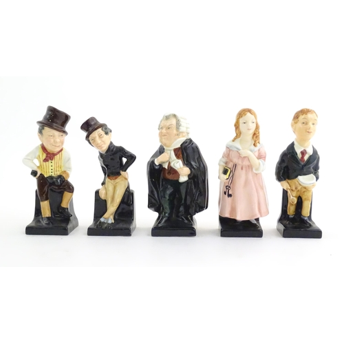 135 - A quantity of Royal Doulton figures to include Charles Dickens figures to include Sam Weller, Oliver... 