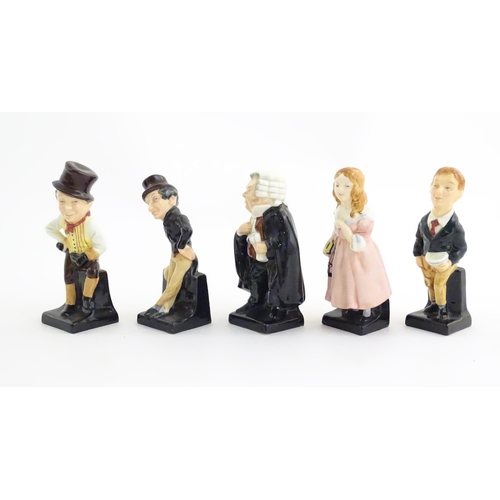 135 - A quantity of Royal Doulton figures to include Charles Dickens figures to include Sam Weller, Oliver... 