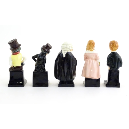 135 - A quantity of Royal Doulton figures to include Charles Dickens figures to include Sam Weller, Oliver... 