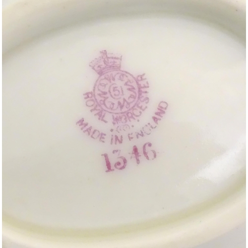 137 - Assorted items of Royal Worcester to include two saucers, a basket vase and two small dishes with fl... 