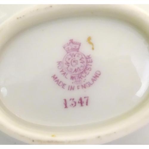 137 - Assorted items of Royal Worcester to include two saucers, a basket vase and two small dishes with fl... 