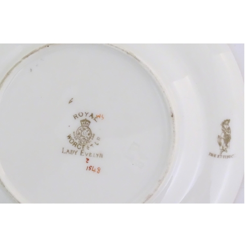 137 - Assorted items of Royal Worcester to include two saucers, a basket vase and two small dishes with fl... 