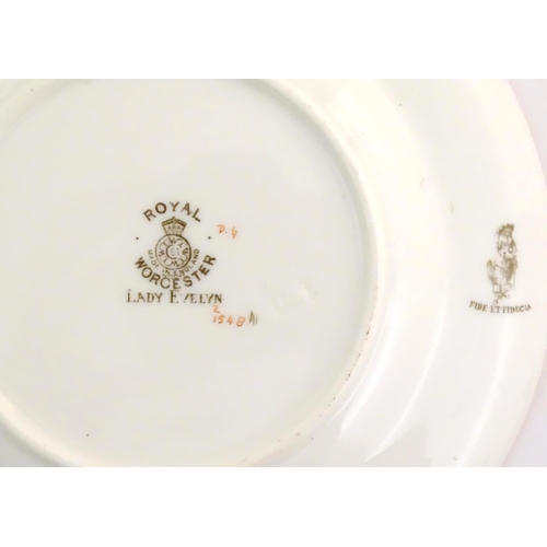 137 - Assorted items of Royal Worcester to include two saucers, a basket vase and two small dishes with fl... 