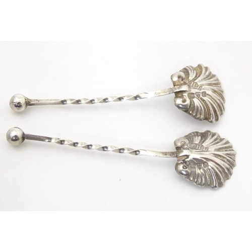 388 - Two silver salt spoons with shell formed bowls, hallmarked Chester 1902 maker William Henry Leather.... 