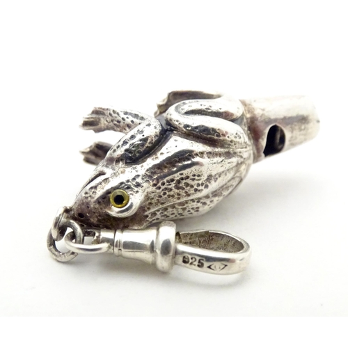 393 - A white metal novelty whistle modelled as a frog. Approx. 1 1/2