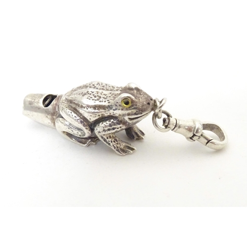 393 - A white metal novelty whistle modelled as a frog. Approx. 1 1/2