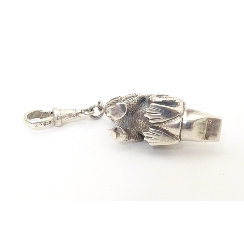 393 - A white metal novelty whistle modelled as a frog. Approx. 1 1/2