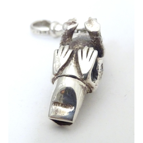 393 - A white metal novelty whistle modelled as a frog. Approx. 1 1/2