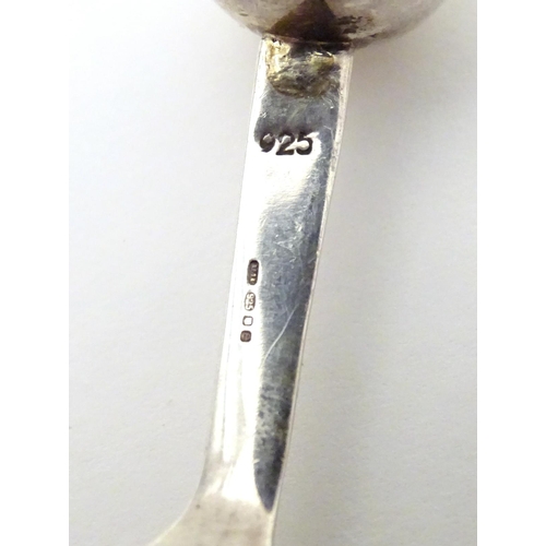 394 - A silver caddy spoon with spherical finial to handle, hallmarked London 2004, maker TPTE. Approx. 3