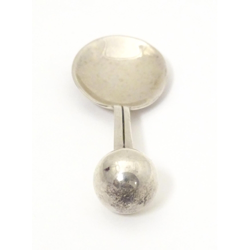 394 - A silver caddy spoon with spherical finial to handle, hallmarked London 2004, maker TPTE. Approx. 3