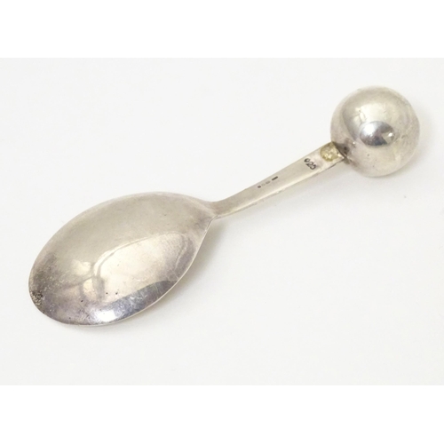 394 - A silver caddy spoon with spherical finial to handle, hallmarked London 2004, maker TPTE. Approx. 3