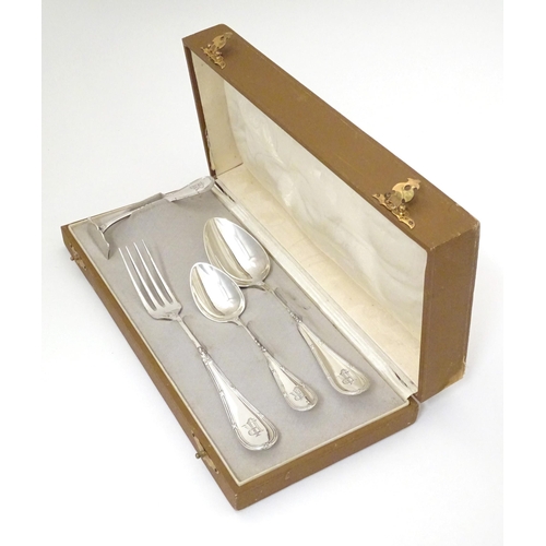 403 - A German .800 silver christening set comprising spoons and fork. Marked N. W. Albers. Cased. Case ap... 