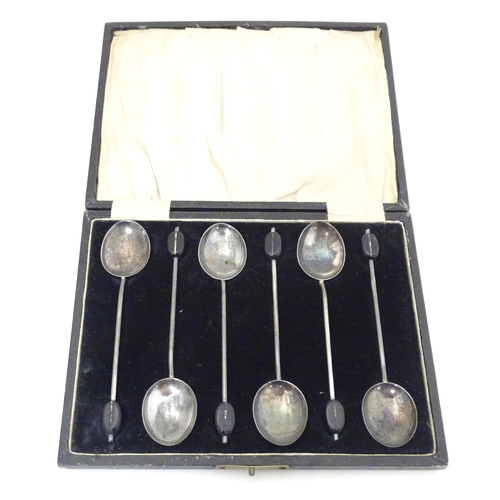 410 - A cased set of six silver coffee spoons the handles surmounted by coffee beans, hallmarked Birmingha... 