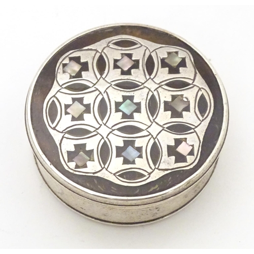 515 - A 19thC white metal and tortoiseshell pill box with pique work and mother of pearl inlay to top. App... 