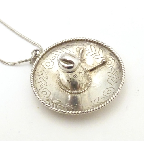 517 - Assorted silver and white metal items to include Mexican pendant formed as a sombrero, various salt ... 