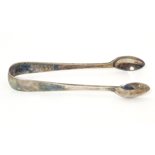 524 - Silver sugar tongs hallmarked Glasgow 1926, maker James Weir. Approx. 4