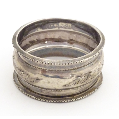 526 - A silver napkin ring hallmarked Birmingham 1900, maker Henry Hobson & Sons. Together with a Geo III ... 