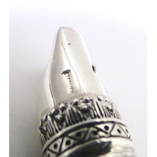 529 - A white metal novelty whistle modelled as a horse. Approx. 1 3/4