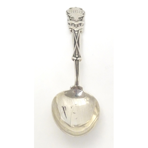 533 - A silver teaspoon the handle with gold club and ball decoration and engraved HGC, possible for Hamps... 