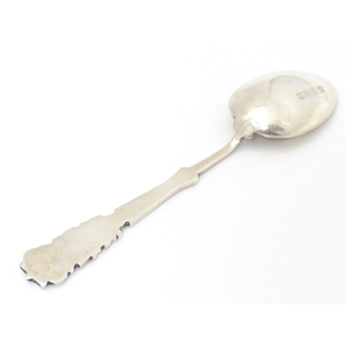 533 - A silver teaspoon the handle with gold club and ball decoration and engraved HGC, possible for Hamps... 