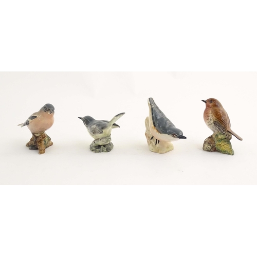 146 - A quantity of Bewsick models of birds, to include Blue Tit, model no. 992, Songthrush, no. 2308, Cha... 