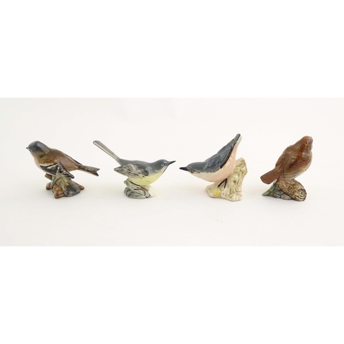 146 - A quantity of Bewsick models of birds, to include Blue Tit, model no. 992, Songthrush, no. 2308, Cha... 