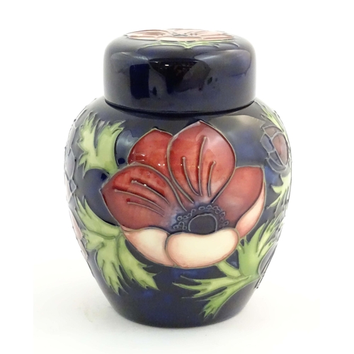 153 - A limited edition Moorcroft ginger jar in the Anemone pattern. Marked under with impressed jug and n... 