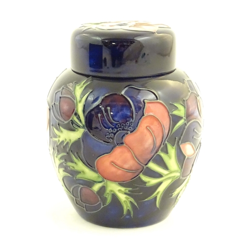 153 - A limited edition Moorcroft ginger jar in the Anemone pattern. Marked under with impressed jug and n... 