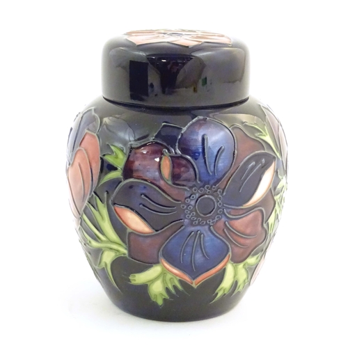 153 - A limited edition Moorcroft ginger jar in the Anemone pattern. Marked under with impressed jug and n... 