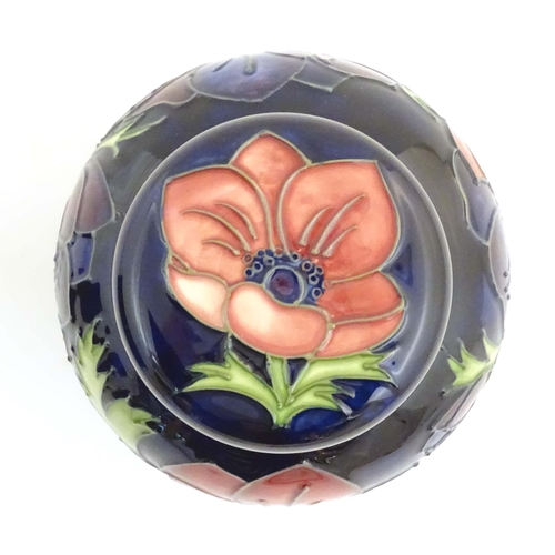 153 - A limited edition Moorcroft ginger jar in the Anemone pattern. Marked under with impressed jug and n... 