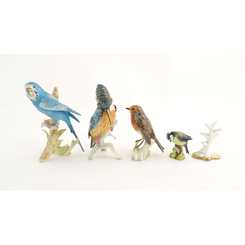 183 - Four assorted models of birds to include a Goebel model of a Budgerigar, no. 3851218, a Goebel Robin... 