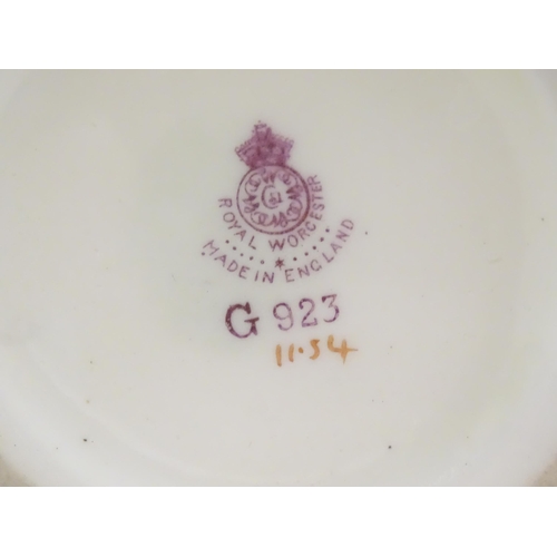 189 - A quantity of assorted ceramic items to include a Royal Worcester vase with a flared rim decorated w... 