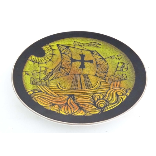 195 - A Poole Pottery charger in the pattern Aegean, with stylised galleon ship detail. Marked under and s... 